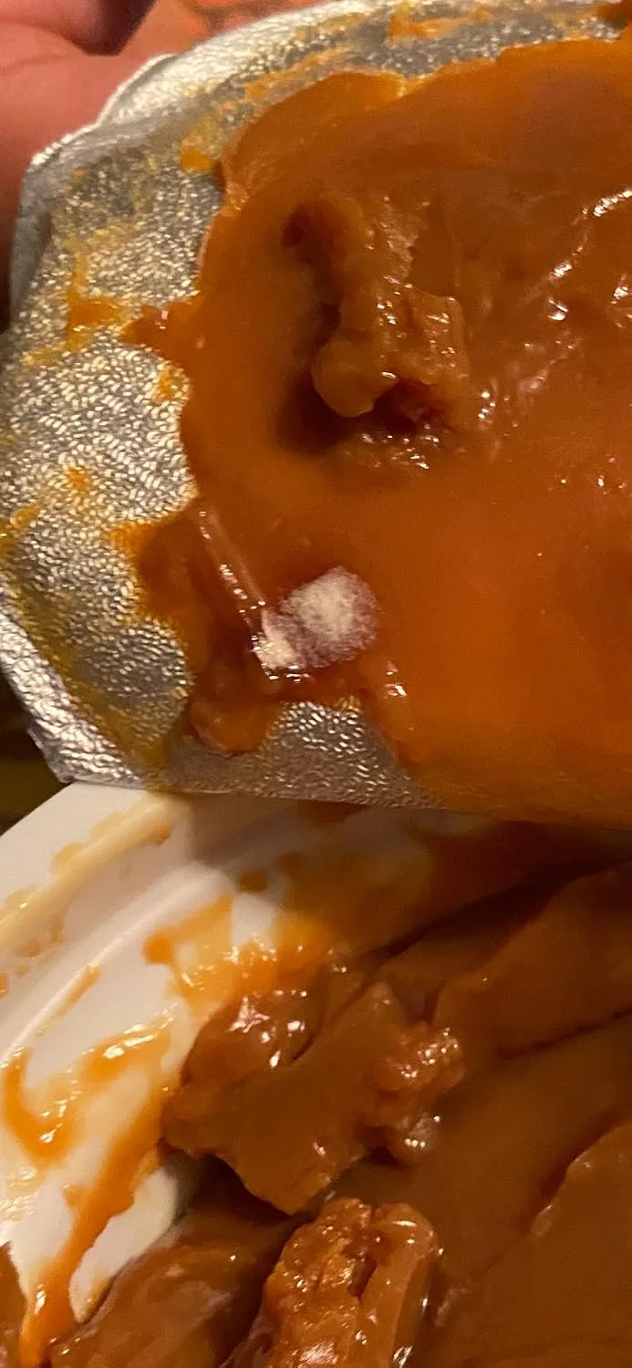 Customer photo of homemade caramel thumbprint cookies with filled indentations on a cooling rack