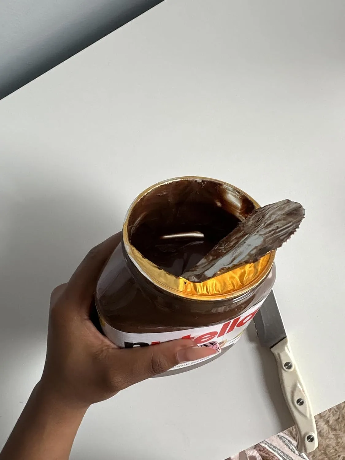 Customer photo of Nutella-stuffed chocolate chip cookies showing the gooey hazelnut filling inside