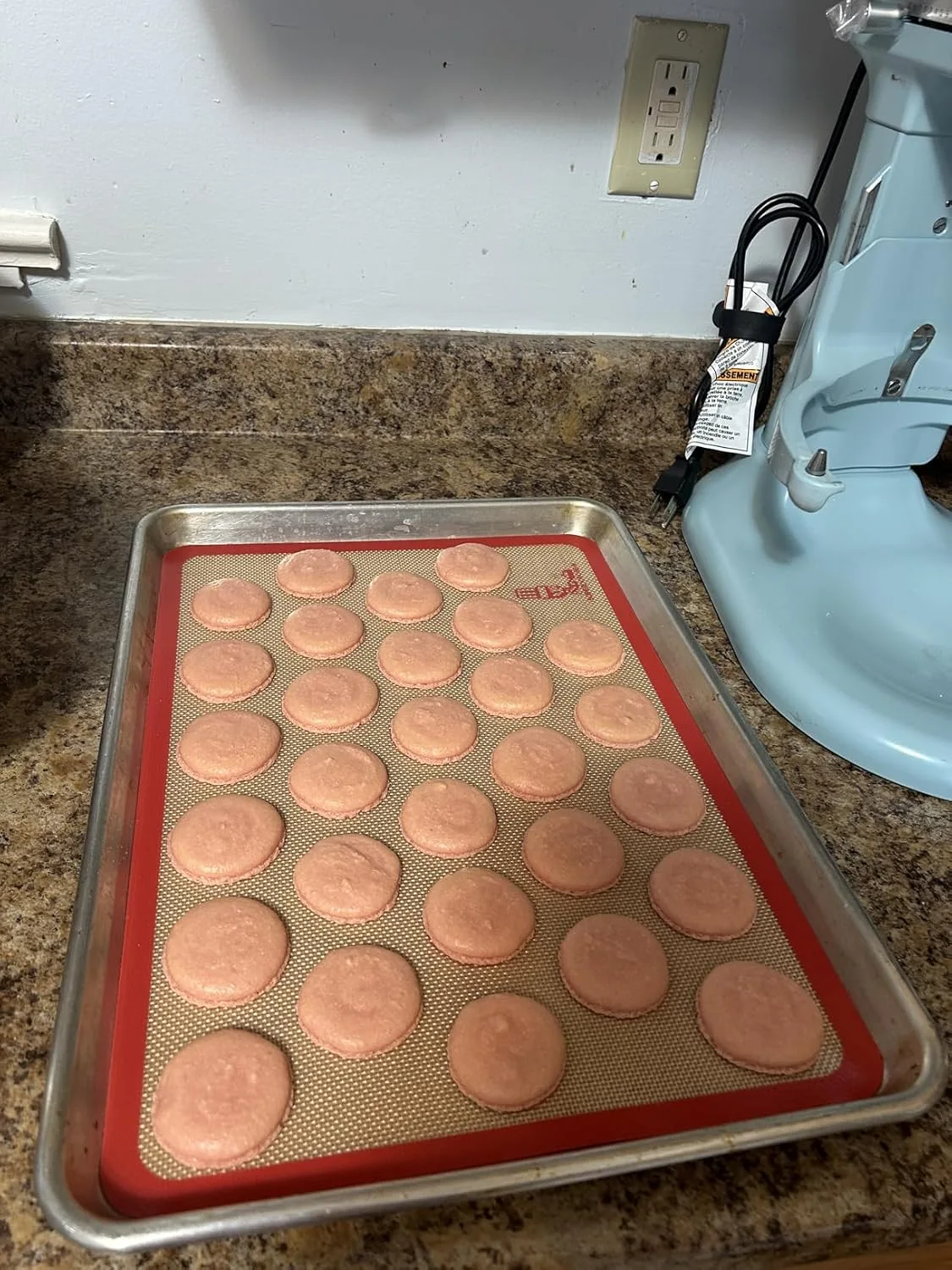 Customer photo of cream-filled chocolate cookies stacked and broken in half