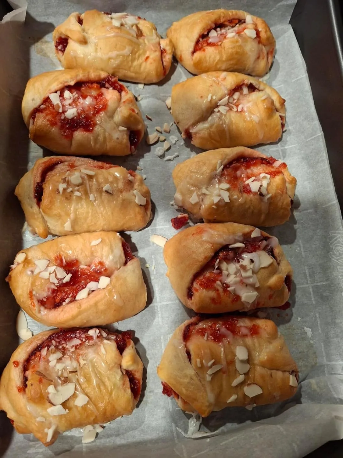 Customer photo of thumbprint cookies with jam centers cooling on a baking sheet