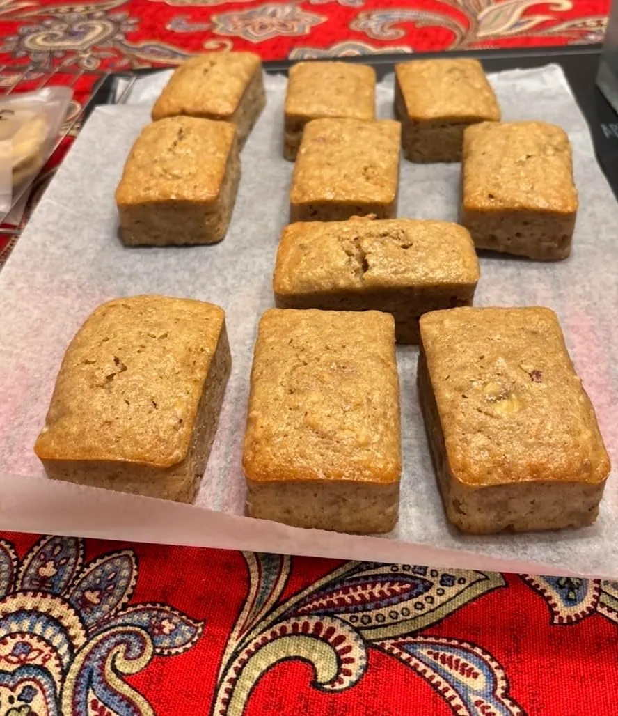 Customer photo of green tea shortbread cookies arranged on a plate, showing their delicate texture and pale green hue